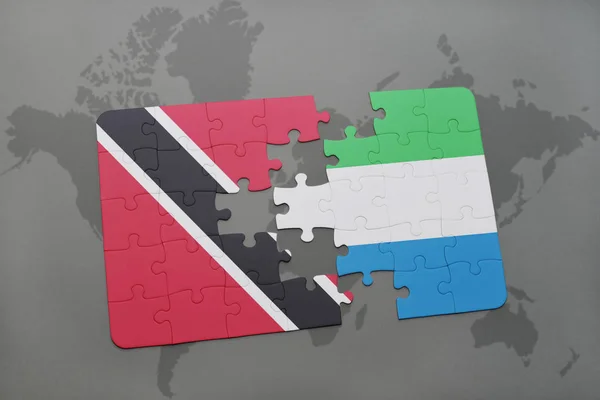 Puzzle avec le drapeau national de Trinidad et tobago et Sierra Leone sur une carte du monde — Photo