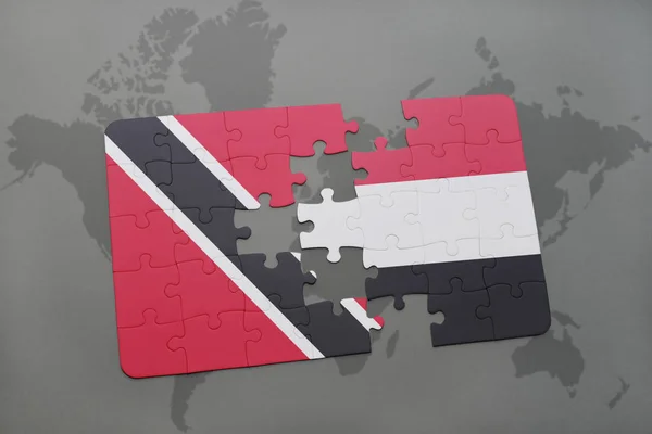 Puzzle avec le drapeau national de Trinidad et tobago et le Yémen sur une carte du monde — Photo
