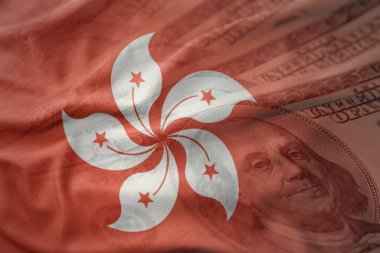 renkli bir Amerikan Doları para arka plan hong Kong Ulusal bayrağını sallıyor. Ekonomi kavramı