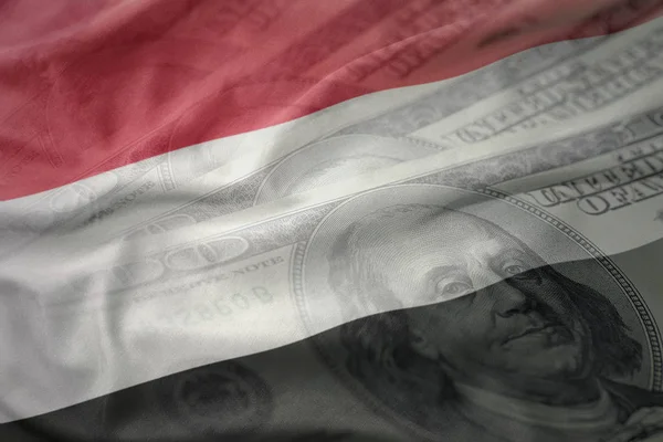 Barevné mávat státní vlajka Jemenu na americký dolar peníze pozadí. finanční koncept — Stock fotografie