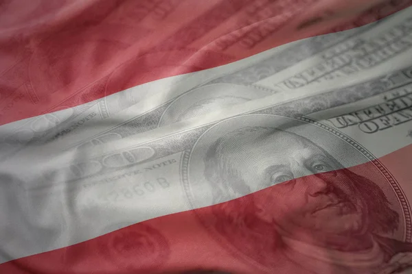 Colorido acenando bandeira nacional da Áustria em um fundo de dinheiro dólar americano. conceito de financiamento — Fotografia de Stock