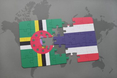 Dominika ve Tayland ulusal bayrak bir dünya haritası üzerinde ile bulmaca