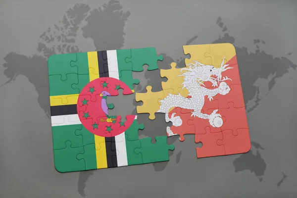Puzzel met de nationale vlag van dominica en bhutan op een wereldkaart — Stockfoto