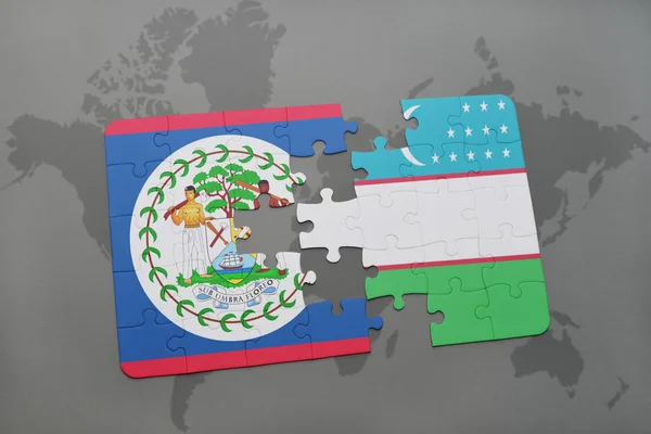 Rompecabezas con la bandera nacional de Belice y Uzbekistán en un mapa del mundo — Foto de Stock