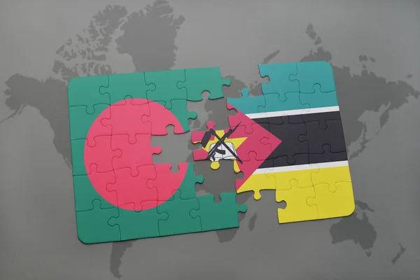 Puzzle with the national flag of bangladesh and mozambique on a world map — Stock Photo, Image