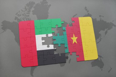 Birleşik Arap Emirlikleri ve Kamerun ulusal bayrak bir dünya haritası üzerinde ile bulmaca
