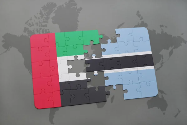 Puzzle z Flaga narodowa Zjednoczone Emiraty Arabskie i Botswany na mapie świata — Zdjęcie stockowe