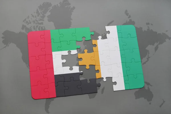 益智与阿拉伯联合酋长国和科特迪瓦在世界地图上的国旗 — 图库照片