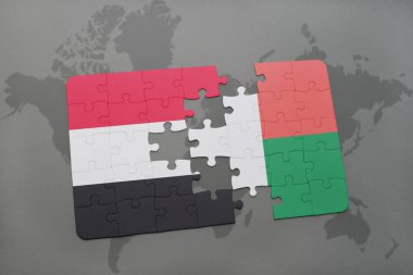 yemen ve Madagaskar ulusal bayrak bir dünya haritası üzerinde ile bulmaca