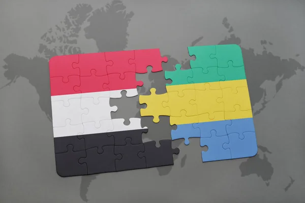 Puzzel met de nationale vlag van Jemen en gabon op een wereldkaart — Stockfoto