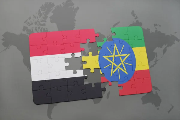 Rompecabezas con la bandera nacional de yemen y ethiopia en un mapa del mundo —  Fotos de Stock