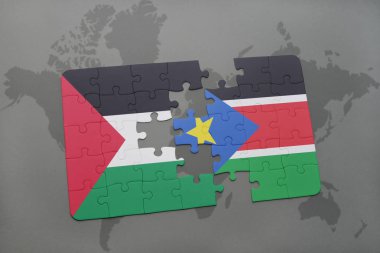 bir dünya haritası üzerinde Güney sudan ve Filistin bayrağı ile bulmaca
