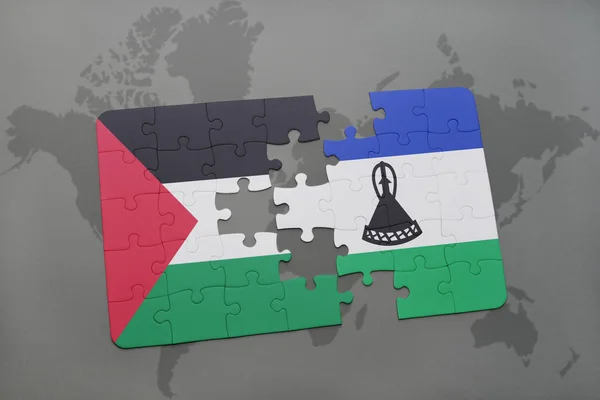 Puzzel met de nationale vlag van Palestina en lesotho op een wereldkaart — Stockfoto