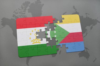 bir dünya haritası üzerinde Tacikistan ve Komor bayrağı ulusal ile bulmaca