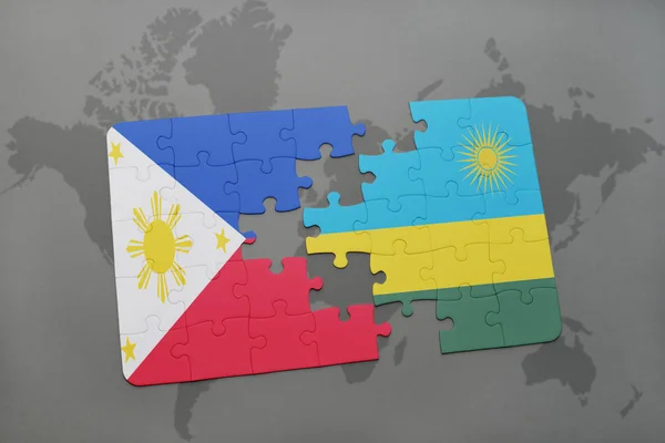 フィリピン、ルワンダの国旗は世界地図のパズルします。 — ストック写真