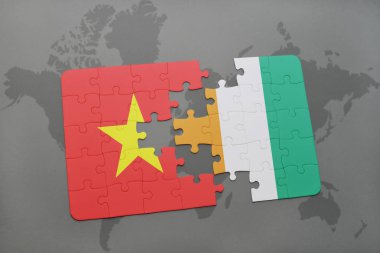 vietnam ulusal bayrak ile bulmaca ve Fildişi Sahili bir dünya haritası üzerinde