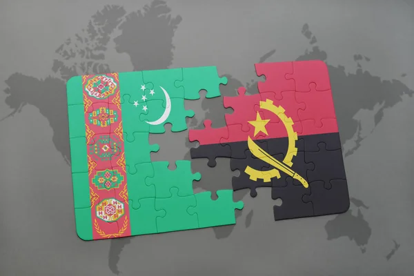 Puzzel met de nationale vlag van turkmenistan en angola op een wereldkaart — Stockfoto