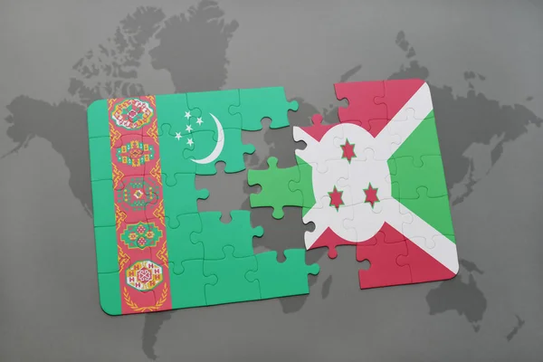 Puzzel met de nationale vlag van turkmenistan en burundi op een wereldkaart — Stockfoto