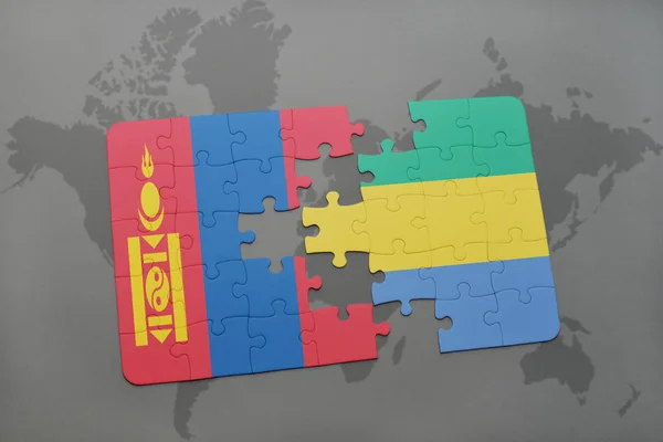Puzzle con la bandiera nazionale di mongolia e gabon su una mappa del mondo — Foto Stock