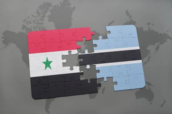 Головоломка з Національний прапор Сирії та Ботсвана на карті світу — стокове фото