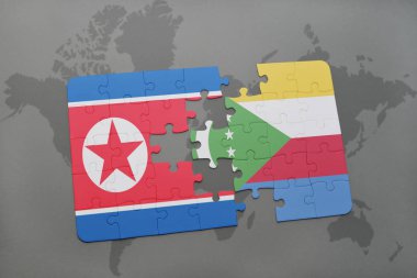 Kuzey Kore ve Komor Adaları ulusal bayrak bir dünya haritası üzerinde ile bulmaca