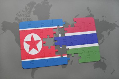 Kuzey Kore ve Gambiya ulusal bayrak bir dünya haritası üzerinde ile bulmaca