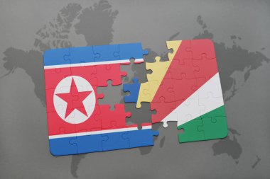 Kuzey Kore ve Seyşeller ulusal bayrak bir dünya haritası üzerinde ile bulmaca