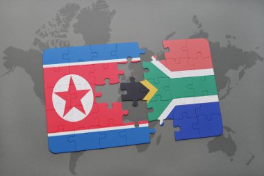 Kuzey Kore ve Güney Afrika ulusal bayrak bir dünya haritası üzerinde ile bulmaca