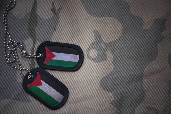 Armén tomt, Dogtag med flagga av Palestina i khaki textur bakgrunden. militära begrepp — Stockfoto