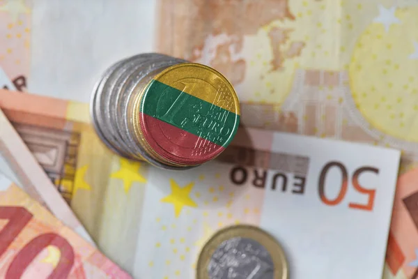 Euro coin with national flag of lithuania on the euro money banknotes background. — Stock Photo, Image