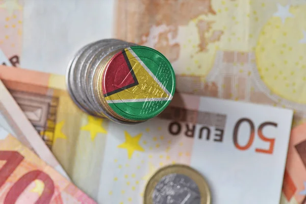 Euro coin with national flag of guyana on the euro money banknotes background. — Stock Photo, Image