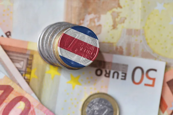 Euro coin with national flag of costa rica on the euro money banknotes background. — Stock Photo, Image