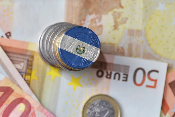Euro coin with national flag of el salvador on the euro money banknotes background. — Stock Photo, Image