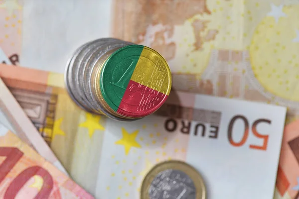 Euro coin with national flag of benin on the euro money banknotes background. — Stock Photo, Image