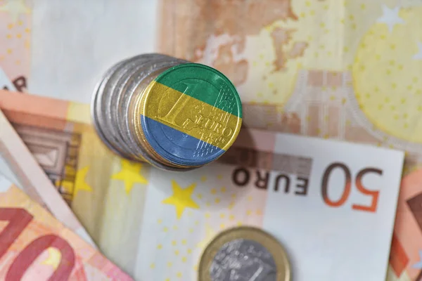 Euro coin with national flag of gabon on the euro money banknotes background. — Stock Photo, Image