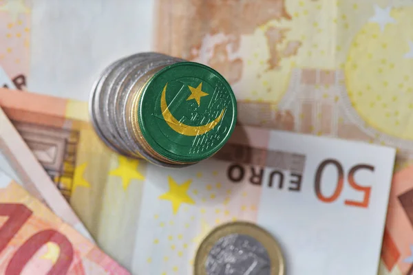 Euro coin with national flag of mauritania on the euro money banknotes background. — Stock Photo, Image