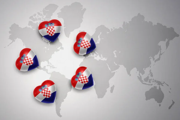 Five hearts with national flag of croatia on a world map background. — Stock Photo, Image