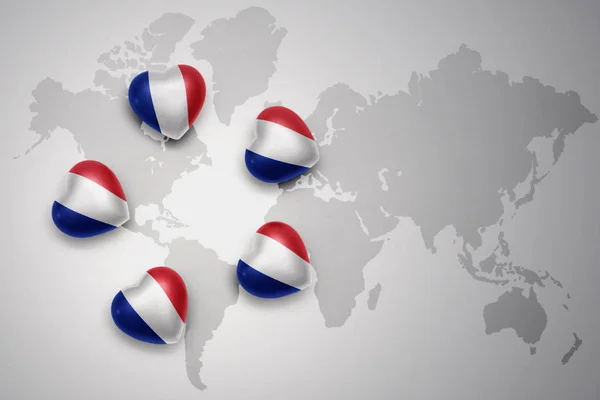 Five hearts with national flag of france on a world map background. — Stock Photo, Image