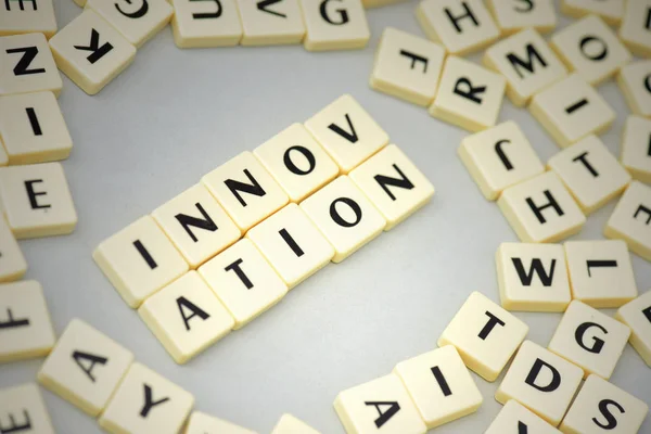 Text innovation on the gray background near the letters. — Stock Photo, Image