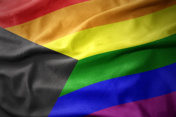 Bahamalar gökkuşağı Eşcinsel gurur bayrak bayrak sallayarak — Stok fotoğraf