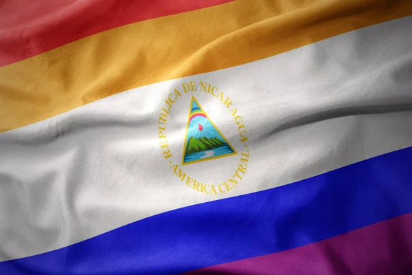 Waving nicaragua rainbow gay pride flag banner — Stock Photo, Image