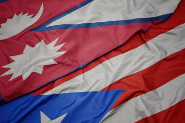 Porto Riko 'nun renkli bayrağı ve Nepal' in ulusal bayrağı sallanıyor..