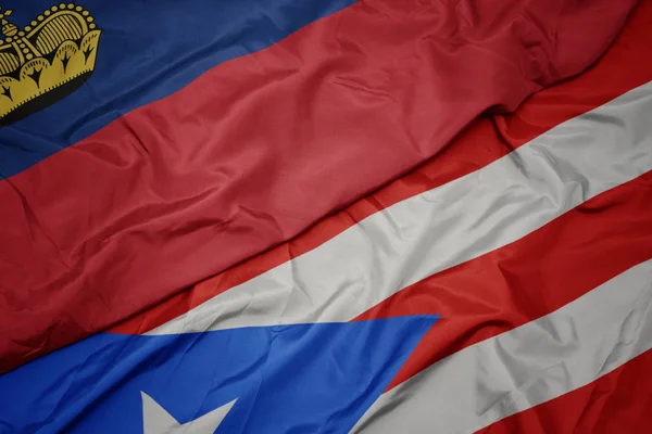 Machanie kolorową flagą puerto rico i flagą narodową liechtenstein. — Zdjęcie stockowe