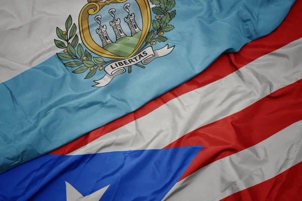 Machanie kolorowa flaga puerto rico i flaga narodowa San Marino. — Zdjęcie stockowe