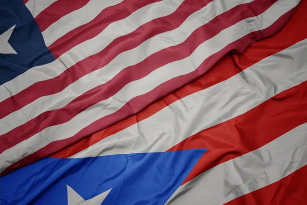 Porto Riko 'nun renkli bayrağı ve Liberya' nın ulusal bayrağı sallanıyor.. — Stok fotoğraf