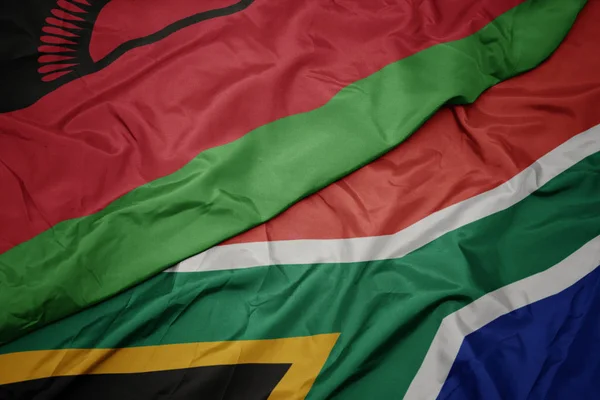 Waving colorful flag of south africa and national flag of malawi. — Stock Photo, Image