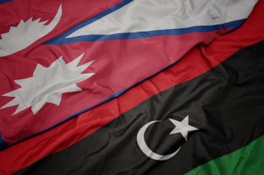 Libya 'nın renkli bayrağı ve Nepal' in ulusal bayrağı sallanıyor..