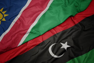 Libya 'nın renkli bayrağı ve Namibya' nın ulusal bayrağı sallanıyor..