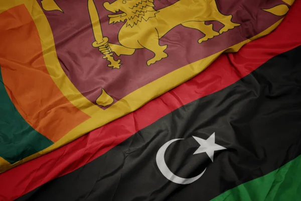 Ondeando colorida bandera de libya y bandera nacional de sri lanka . — Foto de Stock
