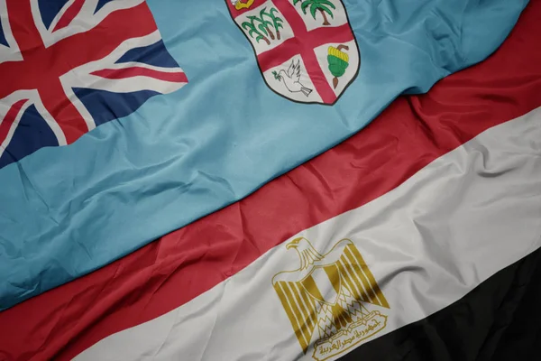 Waving colorful flag of egypt and national flag of Fiji . — Stock Photo, Image